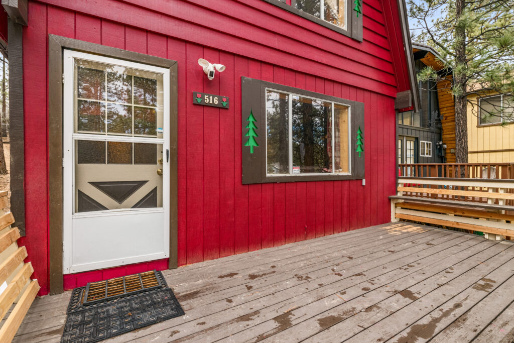 A red house with a door and windows.