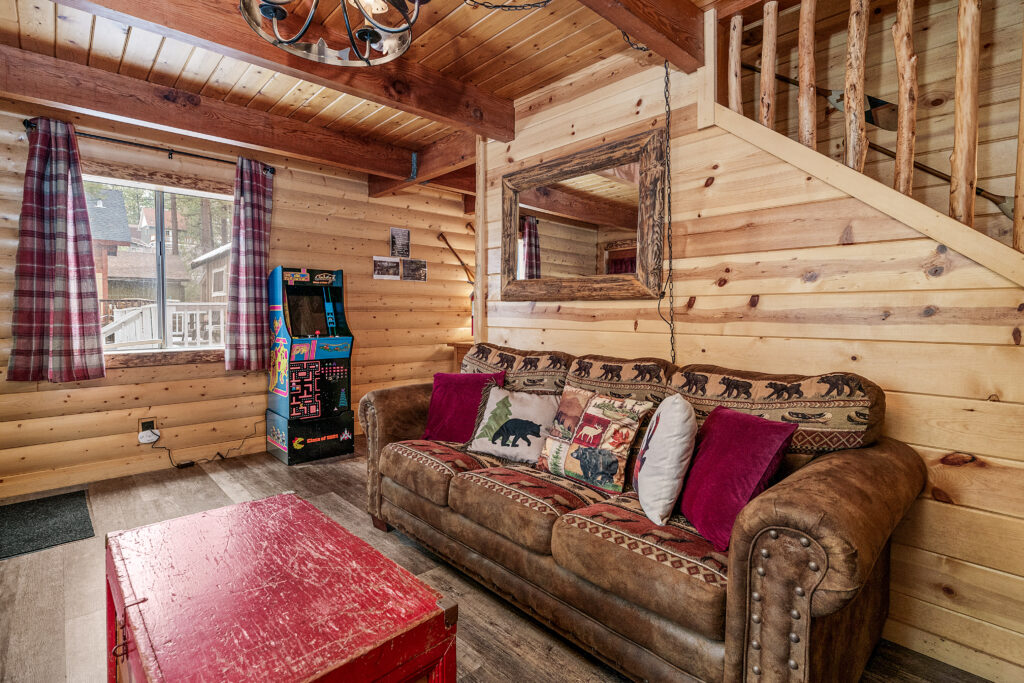 A living room with a couch and a table