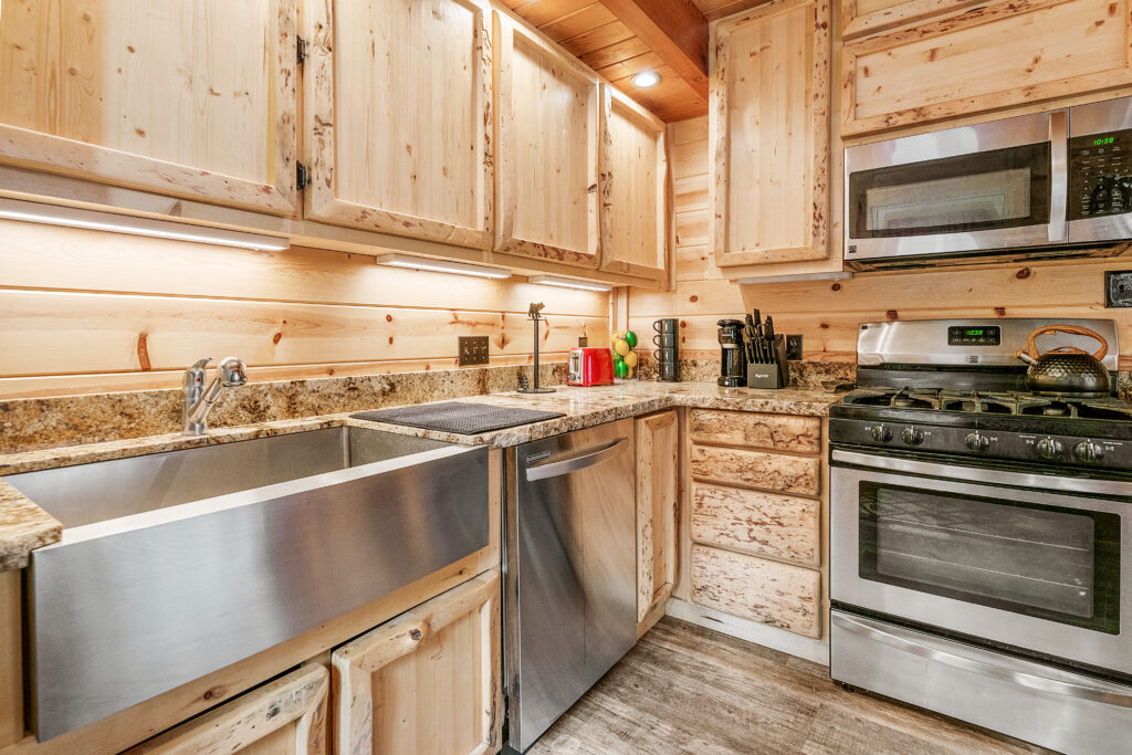 A kitchen with wooden cabinets and stainless steel appliances.