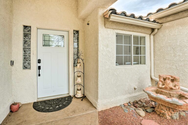 A white door and window in the middle of a house.